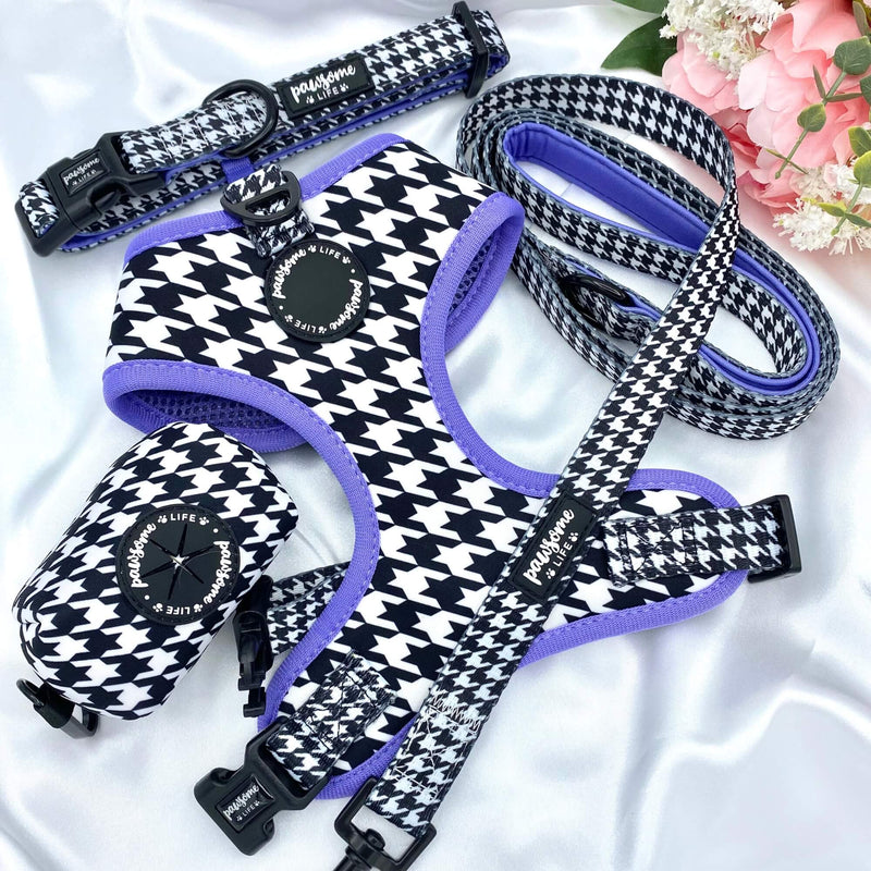 Eye-catching dog poop bag dispenser showcasing a houndstooth pattern and purple details for a chic and convenient pet accessory