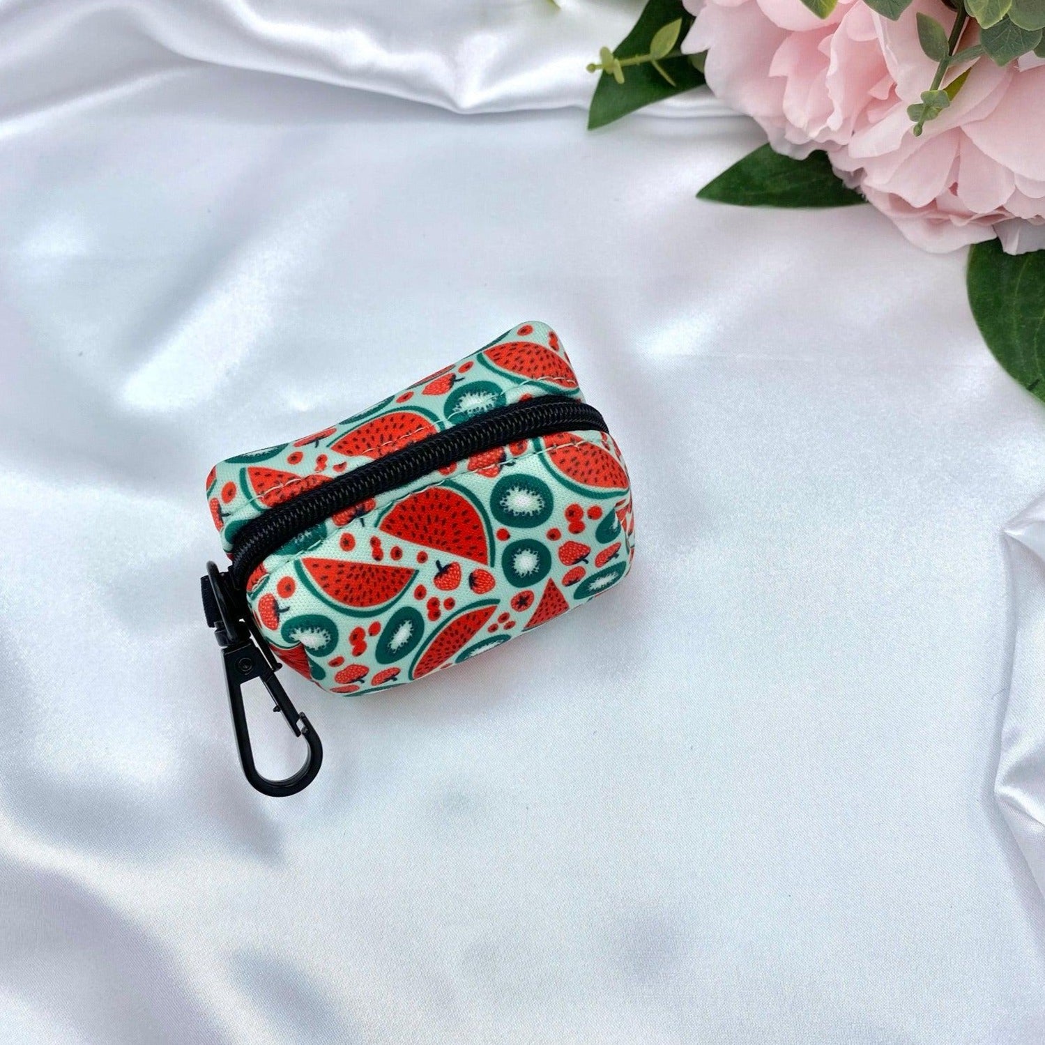 Eye-catching watermelon-patterned dog poop bag dispenser for a chic and convenient pet accessory