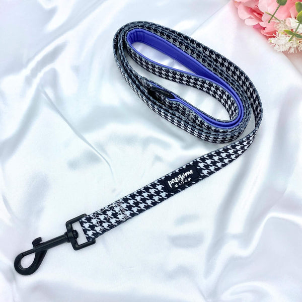 Cute dog leash featuring a vibrant houndstooth pattern and purple details with secure golden clasp, perfect for stylish walks