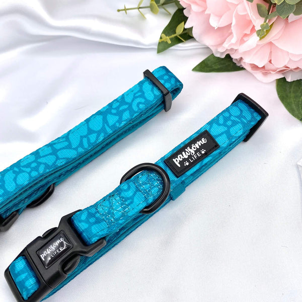 Cute dog collar featuring a dark teal abstract design and a quick-release buckle for easy use
