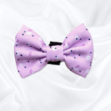 Cute dog bow with a pink, lilac, and purple design, adding a touch of charm to your pet's look