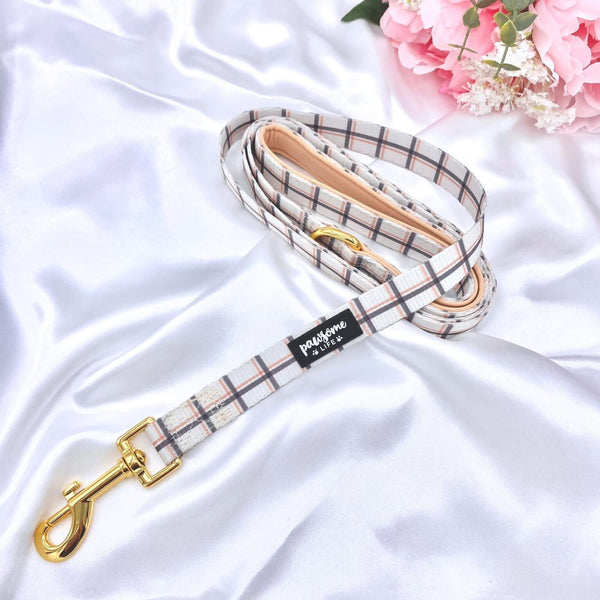 Stylish plaid dog leash featuring a secure golden clasp for easy attachment