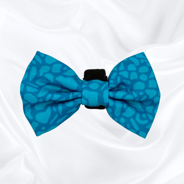 Cute dog bow tie with a dark teal abstract design, easy to attach with its velcro fastening