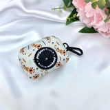 Cute dog poop bag holder with a playful tiger pattern for stylish waste disposal