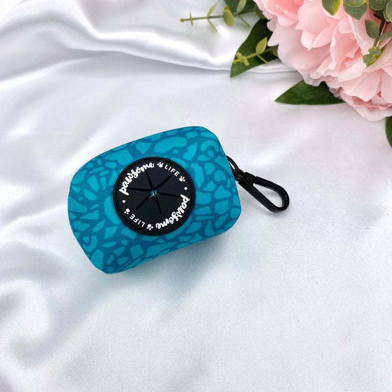 Cute dog poop bag holder featuring a dark teal abstract design, perfect for stylish pet owners