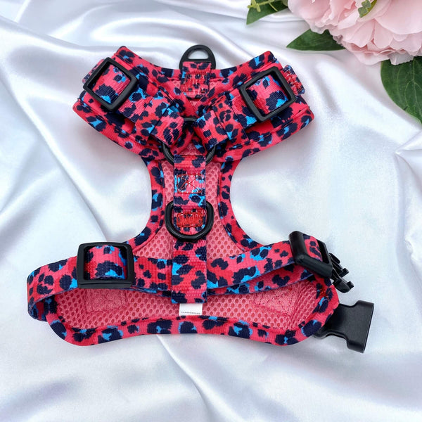 No-pull dog harness featuring a vibrant pink leopard pattern, ideal for active pets