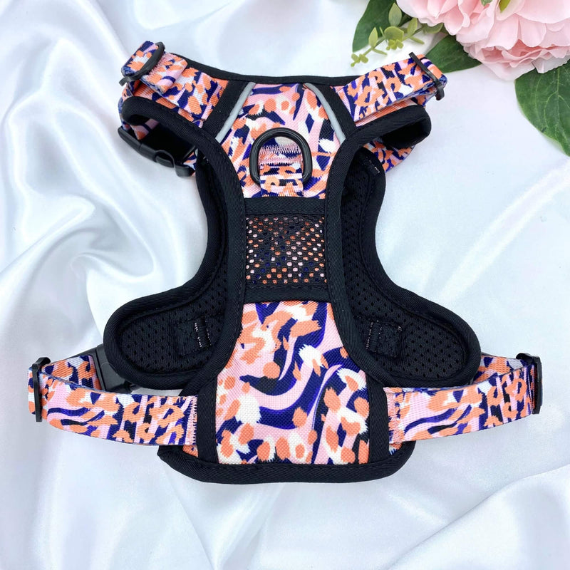 Functional and comfortable dog harness with a bold orange leopard design, perfect for daily adventures