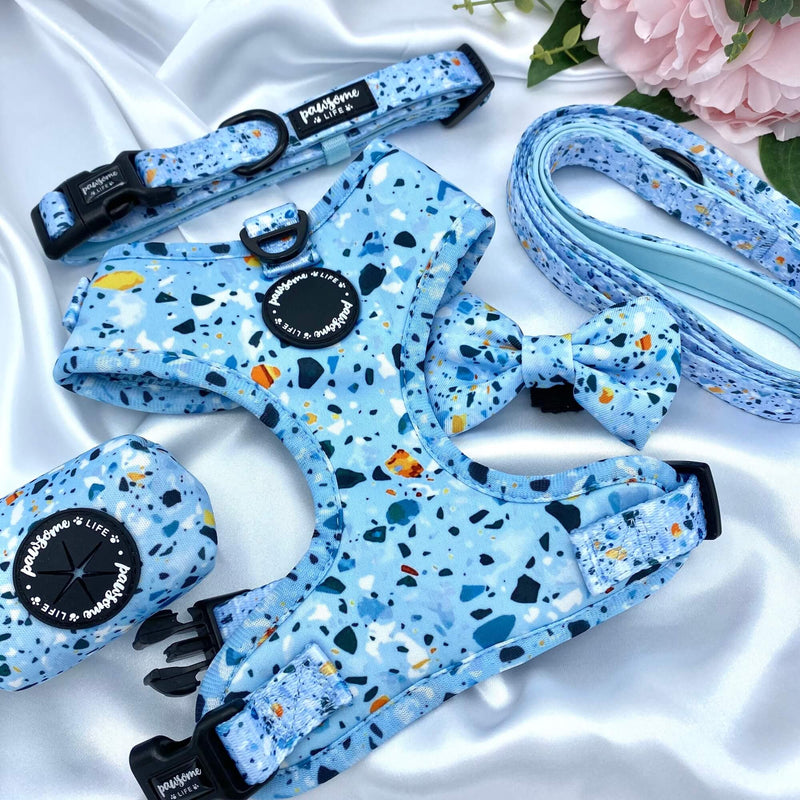 Stylish dog bow featuring a vibrant blue terrazzo pattern, perfect for adding a pop of style