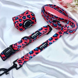 Stylish dog waste bag holder featuring a pink leopard design, a must-have for pet outings