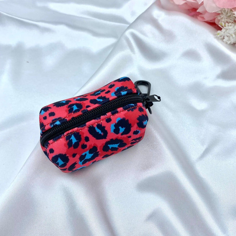 Cute dog poop bag holder with a designer pattern for dog waste