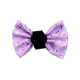Designer dog bow showcasing a vibrant pink, lilac, and purple pattern, perfect for stylish occasions