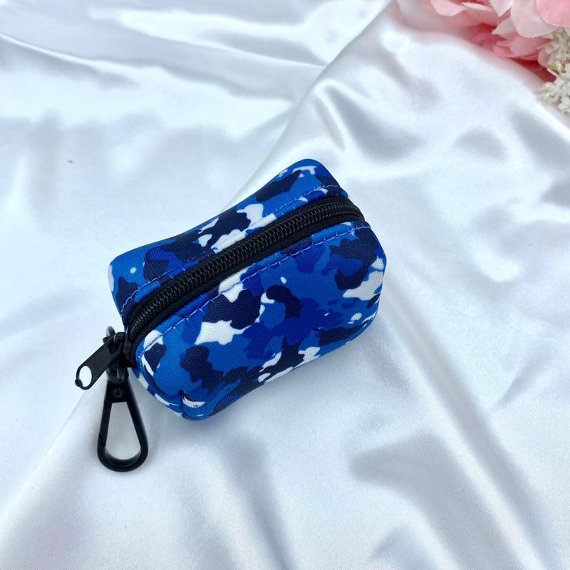 Designer blue camouflage-patterned poop bag dispenser, combining practicality with unique design