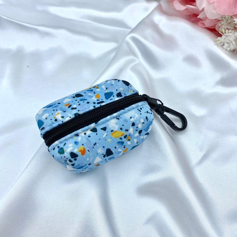 Cute dog poop bag holder with a designer pattern for dog waste