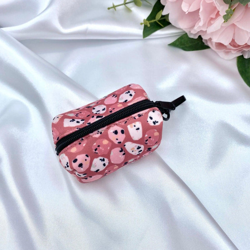 Cute dog poop bag holder with a designer pattern for dog waste