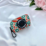 Cute dog poop bag holder with a playful watermelon pattern for stylish waste disposal